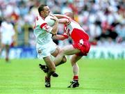 5 August 2001; Gerard Cavlan of Tyrone in action against Gareth Doherty of Derry during the Bank of Ireland All-Ireland Senior Football Championship Quarter-Final match between Derry v Tyrone at St. Tiernach's Park in Clones, Monaghan. Photo by David Maher/Sportsfile