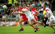 5 August 2001; Ryan McMenamin of Tyrone in action against Johnny McBride of Derry during the Bank of Ireland All-Ireland Senior Football Championship Quarter-Final match between Derry v Tyrone at St. Tiernach's Park in Clones, Monaghan. Photo by David Maher/Sportsfile