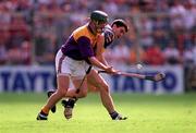 17 August 1997; Larry Murphy of Wexford in action against Liam Sheedy of Tipperary during the Guinness All-Ireland Senior Hurling Championship Semi-Final match between Tipperary and Wexford at Croke Park in Dublin. Photo by David Maher/Sportsfile