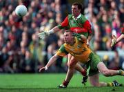 29 September 1996; Tommy Dowd of Meath in action against Kenneth Mortimer of Mayo during the All-Ireland Senior Football Championship Final Replay match between Meath and Mayo at Croke Park in Dublin. Photo by Ray McManus/Sportsfile