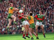 29 September 1996; Trevor Giles of Meath and John McDermot, right, battle for possession against David Brady, left, and Noel Connelly of Mayo during the All-Ireland Senior Football Championship Final Replay match between Meath and Mayo at Croke Park in Dublin. Photo by Ray McManus/Sportsfile