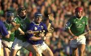 2 August 2001; Eoin Kelly of Tipperary is tackled by Mark O'Riordan of Limerick during the Munster GAA U21 Hurling Championship Final match between Limerick and Tipperary at the Gaelic Grounds in Limerick. Photo by Matt Browne/Sportsfile
