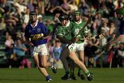 2 August 2001; Eoin Foley of Limerick bursts through the  Tipperary defence during the Munster GAA U21 Hurling Championship Final match between Limerick and Tipperary at the Gaelic Grounds in Limerick. Photo by Matt Browne/Sportsfile