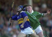 2 August 2001; Eoin Kelly of Tipperary is tackled by Sean O'Connor of Limerick during the Munster GAA U21 Hurling Championship Final match between Limerick and Tipperary at the Gaelic Grounds in Limerick. Photo by Matt Browne/Sportsfile