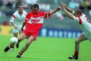 5 August 2001; Kieran McNally of Derry in action against Sean Teague of Tyrone during the Bank of Ireland All-Ireland Senior Football Championship Quarter-Final match between Derry v Tyrone at St. Tiernach's Park in Clones, Monaghan. Photo by David Maher/Sportsfile