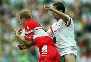5 August 2001; Fergal Doherty of Derry in action against Stephen O'Neill of Tyrone during the Bank of Ireland All-Ireland Senior Football Championship Quarter-Final match between Derry v Tyrone at St. Tiernach's Park in Clones, Monaghan. Photo by David Maher/Sportsfile