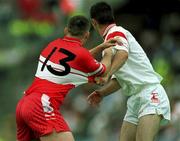 5 August 2001; Ciaran Gourley of Tyrone holds Patrick Bradley of Derry during the Bank of Ireland All-Ireland Senior Football Championship Quarter-Final match between Derry v Tyrone at St. Tiernach's Park in Clones, Monaghan. Photo by David Maher/Sportsfile