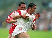 5 August 2001; Stephen O'Neill of Tyrone in action against Gary Coleman of Derry during the Bank of Ireland All-Ireland Senior Football Championship Quarter-Final match between Derry v Tyrone at St. Tiernach's Park in Clones, Monaghan. Photo by David Maher/Sportsfile