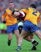 4 August 2001; Derek Savage of Galway is tackled by Denis Gavin of Roscommon during the Bank of Ireland All-Ireland Senior Football Championship Quarter Final match between Galway and Roscommon at Castlebar in Mayo. Photo by Matt Browne/Sportsfile
