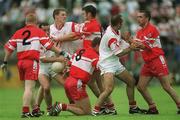 5 August 2001; Derry players, from left, Gareth Doherty, Anthony Tohill, 8, Paul McFlynn and Kieran McNally become involved with Tyrone player's Brian Dooher, Cormac McAnallen and Declan McCrossan during the Bank of Ireland All-Ireland Senior Football Championship Quarter-Final match between Derry v Tyrone at St. Tiernach's Park in Clones, Monaghan. Photo by David Maher/Sportsfile