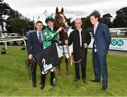 14 July 2016; Jockey George Baker and the winning connections of Decorated Knight after the ICON Meld Stakes during the Bulmers Evening Meeting at Leopardstown in Dublin. Photo by Cody Glenn/Sportsfile