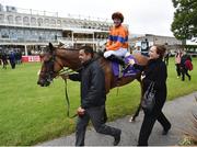14 July 2016; Jockey Ana O'Brien enters the parade ring on Arya Tara after winning the Irish Stallion Farms European Breeders Fund Stanerra Stakes during the Bulmers Evening Meeting at Leopardstown in Dublin. Photo by Cody Glenn/Sportsfile