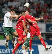 3 September 2010; Gavin Gunning, Republic of Ireland, in action against Pajtim Kasami and Fabio Daprela, right, Switzerland. UEFA European U21 Championship Qualifier, Switzerland v Republic of Ireland, Cornaredo, Lugano, Switzerland. Picture credit: Patrick Straub / SPORTSFILE