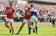 16 July 2016; Peter Kelleher of Cork is tackled by Barry Gilleran of Longford during the GAA Football All-Ireland Senior Championship Round 3B match between Longford and Cork at Glennon Brothers Pearse Park in Longford. Photo by Ramsey Cardy/Sportsfile