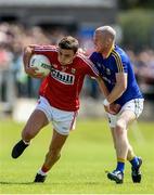 16 July 2016; Mark Collins of Cork is tackled by Dermot Brady of Longford during the GAA Football All-Ireland Senior Championship Round 3B match between Longford and Cork at Glennon Brothers Pearse Park in Longford. Photo by Ramsey Cardy/Sportsfile