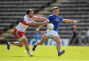 16 July 2016; Padraig Faulkner of Cavan gets in his kick as he is challenged by Mark Lynch of Derry during the GAA Football All-Ireland Senior Championship Round 3A match between Cavan and Derry at Kingspan Breffni Park in Cavan. Photo by Brendan Moran/Sportsfile