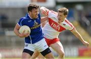 16 July 2016; Conor Moynagh of Cavan in action against Eoghan Brown of Derry during the GAA Football All-Ireland Senior Championship Round 3A match between Cavan and Derry at Kingspan Breffni Park in Cavan. Photo by Brendan Moran/Sportsfile