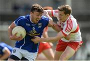 16 July 2016; Conor Moynagh of Cavan in action against Eoghan Brown of Derry during the GAA Football All-Ireland Senior Championship Round 3A match between Cavan and Derry at Kingspan Breffni Park in Cavan. Photo by Brendan Moran/Sportsfile