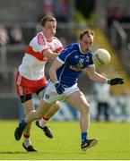 16 July 2016; Martin Reilly of Cavan in action against Brendan Rogers of Derry during the GAA Football All-Ireland Senior Championship Round 3A match between Cavan and Derry at Kingspan Breffni Park in Cavan. Photo by Brendan Moran/Sportsfile