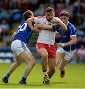 16 July 2016; Emmett McGuckin of Derry is tackled by Martin Reilly of Cavan during the GAA Football All-Ireland Senior Championship Round 3A match between Cavan and Derry at Kingspan Breffni Park in Cavan. Photo by Brendan Moran/Sportsfile