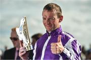 16 July 2016; Jockey Seamie Heffernan celebrates with the trophy after winning the Darley Irish Oaks, aboard Seventh Heaven, at the Curragh Racecourse in the Curragh, Co Kildare. Photo by Sportsfile