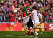 16 July 2016; Donal Vaughan of Mayo is tackled by Kildare goalkeeper Mark Donnellan during the GAA Football All-Ireland Senior Championship Round 3B match between Mayo and Kildare at Elverys MacHale Park in Castlebar, Mayo. Photo by Stephen McCarthy/Sportsfile