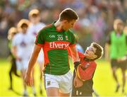 16 July 2016; Barry Moran of Mayo is greeted by a young supporter following the GAA Football All-Ireland Senior Championship Round 3B match between Mayo and Kildare at Elverys MacHale Park in Castlebar, Mayo. Photo by Stephen McCarthy/Sportsfile