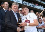 17 July 2016; Pictured is Pat O’Doherty, Chief Executive of ESB, proud sponsor of the Electric Ireland GAA All-Ireland Minor Championships, presenting captain Brian McLoughlin from Kildare with the Player of the Match award for his outstanding performance in the Electric Ireland Leinster Minor Football Championship Final. Throughout the Championship fans can follow the conversation, support the Minors and be a part of something major through the hashtag #GAAThisIsMajor. Croke Park in Dubin. Photo by Ray McManus / SPORTSFILE