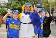 5 September 2010; Tpperary supporters, from left, Tiffany, 11, Peter, and Tanya Forristal, 13, from Cahir, Co. Tipperary, show their support for their team before the match. GAA Hurling All-Ireland Senior Championship Final, Kilkenny v Tipperary, Croke Park, Dublin. Picture credit: Barry Cregg / SPORTSFILE