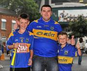5 September 2010; Tipperary supporters, from left, Darragh Brennan, 12, Tomás O'Connor and Kelan Brennan, 9, from Clonmel, Co. Tipperary, show their support for their team before the match. GAA Hurling All-Ireland Senior Championship Final, Kilkenny v Tipperary, Croke Park, Dublin. Picture credit: Barry Cregg / SPORTSFILE