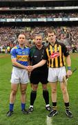 5 September 2010; Tipperary captain Eoin Kelly and Kilkenny captain TJ Reid shake hands across referee Michael Wadding before the start of the game. GAA Hurling All-Ireland Senior Championship Final, Kilkenny v Tipperary, Croke Park, Dublin. Picture credit: Ray McManus / SPORTSFILE