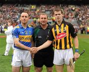 5 September 2010; Tipperary captain Eoin Kelly and Kilkenny captain TJ Reid shake hands across referee Michael Wadding before the start of the game. GAA Hurling All-Ireland Senior Championship Final, Kilkenny v Tipperary, Croke Park, Dublin. Picture credit: Ray McManus / SPORTSFILE