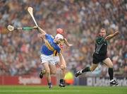 5 September 2010; Referee Mchael Wadding waves play on as Brendan Maher, Tipperary, is tackled by John Tennyson, Kilkenny, he subsequently awarded a free. GAA Hurling All-Ireland Senior Championship Final, Kilkenny v Tipperary, Croke Park, Dublin. Picture credit: Ray McManus / SPORTSFILE