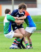 5 September 2010; Leinster's Sean O'Loughlin is tackled by the Exiles defence. Under-19 Friendly - Exiles v Leinster, Sunbury on Thames, Middlesex, England. Picture credit: SPORTSFILE