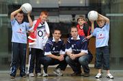 6 September 2010; Ulster Bank stars Colm O’Neill, Cork, and Danny Hughes, Down, pictured with four lucky GAA fans who have been selected by Ulster Bank, official sponsor of the GAA Football All-Ireland Senior Championship, to perform a guard of honour on the pitch in front of a full-house in Croke Park for the eagerly awaited clash between Down and Cork, from left, Jack Boyne, age 8, Malahide, Dublin, Cian Healy, age 10, Lisgoold, Cork, Robert Poland, age 8, Ballynahinch, Co. Down, and Mark L'Estrange, age 8, from Glasnevin, Dublin, in George’s Quay, Dublin, as the colleagues prepare to meet in the upcoming GAA Football All-Ireland Senior Championship Final in Croke Park. Log on to Ulster Bank’s dedicated GAA website, www.ulsterbank.com/gaa for interviews and behind the scenes footage of Ulster Bank’s GAA stars. Ulster Bank, George’s Quay, Dublin. Picture credit: Brendan Moran / SPORTSFILE