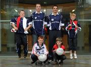 6 September 2010; Ulster Bank stars Colm O’Neill, second from left, Cork, and Danny Hughes, Down, pictured with four lucky GAA fans who have been selected by Ulster Bank, official sponsor of the GAA Football All-Ireland Senior Championship, to perform a guard of honour on the pitch in front of a full-house in Croke Park for the eagerly awaited clash between Down and Cork, from left, Jack Boyne, age 8, from Malahide, Co. Dublin, Cian Healy, age 10, Lisgoold, Cork, Robert Poland, age 8, Ballynahinch, Co. Down and Mark L'Estrange, age 8, from Glasnevin, Dublin, in George’s Quay, Dublin, as the colleagues prepare to meet in the upcoming GAA Football All-Ireland Senior Championship Final in Croke Park. Log on to Ulster Bank’s dedicated GAA website, www.ulsterbank.com/gaa for interviews and behind the scenes footage of Ulster Bank’s GAA stars. Ulster Bank, George’s Quay, Dublin. Picture credit: Brendan Moran / SPORTSFILE