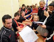 6 September 2010; Kevin McKernan, Mark Poland and James Clarke, Down, sign autographs during a fans open night ahead of their upcoming GAA Football All-Ireland Championship final against Cork. Abbey Grammar School, Newry, Co. Down. Picture credit: Oliver McVeigh / SPORTSFILE