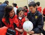 6 September 2010; Damien Rafferty, Down, signs an autograph for Guy and Niamh Ellen Wallace during a fans open night ahead of their upcoming GAA Football All-Ireland Championship final against Cork. Abbey Grammar School, Newry, Co. Down. Picture credit: Oliver McVeigh / SPORTSFILE