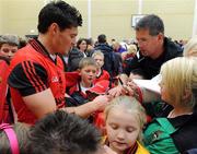 6 September 2010; Martin Clarke, Down, signs autographs during a fans open night ahead of their upcoming GAA Football All-Ireland Championship final against Cork. Abbey Grammar School, Newry, Co. Down. Picture credit: Oliver McVeigh / SPORTSFILE
