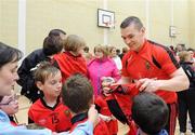 6 September 2010; Kalum King, Down, signs autographs during a fans open night ahead of their upcoming GAA Football All-Ireland Championship final against Cork. Abbey Grammar School, Newry, Co. Down. Picture credit: Oliver McVeigh / SPORTSFILE