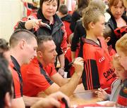 6 September 2010; John Clarke and Mark Doran, Down, sing autographs during a fans open night ahead of their upcoming GAA Football All-Ireland Championship final against Cork. Abbey Grammar School, Newry, Co. Down. Picture credit: Oliver McVeigh / SPORTSFILE