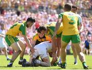 17 July 2016; Rory Brennan of Tyrone under pressure from Donegal players, from left, Mark McHugh, Mark Anthony McGinley, and Michael Murphy during the Ulster GAA Football Senior Championship Final match between Donegal and Tyrone at St Tiernach's Park in Clones, Co Monaghan. Photo by Ramsey Cardy/Sportsfile