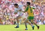 17 July 2016; Sean Cavanagh of Tyrone is tackled by Ryan McHugh of Donegal during the Ulster GAA Football Senior Championship Final match between Donegal and Tyrone at St Tiernach's Park in Clones, Co Monaghan. Photo by Ramsey Cardy/Sportsfile
