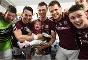 17 July 2016; Finian Hanley, with his daughter Freya, age 5 months, and  Galway team-mates, from left, Gareth Bradshaw, Liam Silke, Johnny Heaney and David Wynne celebrate following the Connacht GAA Football Senior Championship Final Replay match between Galway and Roscommon at Elverys MacHale Park in Castlebar, Co Mayo. Photo by Stephen McCarthy/Sportsfile