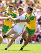 17 July 2016; Peter Harte of Tyrone is tackled by Frank McGlynn of Donegal during the Ulster GAA Football Senior Championship Final match between Donegal and Tyrone at St Tiernach's Park in Clones, Co Monaghan. Photo by Ramsey Cardy/Sportsfile