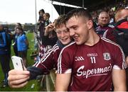 17 July 2016; Damien Comer of Galway poses for a photograph with a supporter during the closing stages of the game in the Connacht GAA Football Senior Championship Final Replay match between Galway and Roscommon at Elverys MacHale Park in Castlebar, Co Mayo. Photo by Stephen McCarthy/Sportsfile