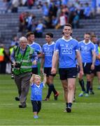 17 July 2016; Eighteen month old Aidan Bastic, a son of Denis, celebrates in front of Dublin's Brian Fenton after the Leinster GAA Football Senior Championship Final match between Dublin and Westmeath at Croke Park in Dubin. Photo by Ray McManus/Sportsfile