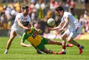 17 July 2016;Ryan McHugh of Donegal in action against Tiernan McCann and Matthew Donnelly of Tyrone during the Ulster GAA Football Senior Championship Final match between Donegal and Tyrone at St Tiernach's Park in Clones, Co Monaghan. Photo by Philip Fitzpatrick/Sportsfile