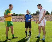 17 July 2016; Referee David Coldrick tosses the coin as Michael Murphy of  Donegal and Sean Cavanagh of Tyrone watch on before the Ulster GAA Football Senior Championship Final match between Donegal and Tyrone at St Tiernach's Park in Clones, Co Monaghan. Photo by Oliver McVeigh/Sportsfile