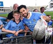 17 July 2016; Keith O'Callaghan, 13 years, from Leixlip, Co Kildare, poses with Cian O'Sullivan and the Delaney Cup after the Leinster GAA Football Senior Championship Final match between Dublin and Westmeath at Croke Park in Dubin. Photo by Ray McManus/Sportsfile